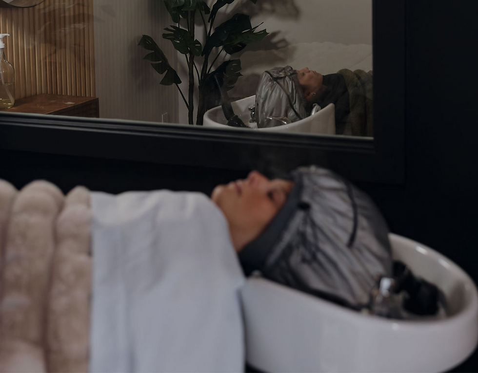 Two guests receiving a shared head spa ritual in a calm, side-by-side setting.