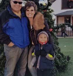 Lisa & Steve with Grandkid at Christmas