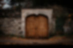 Old wooden double doors set in stone wall_edited.jpg