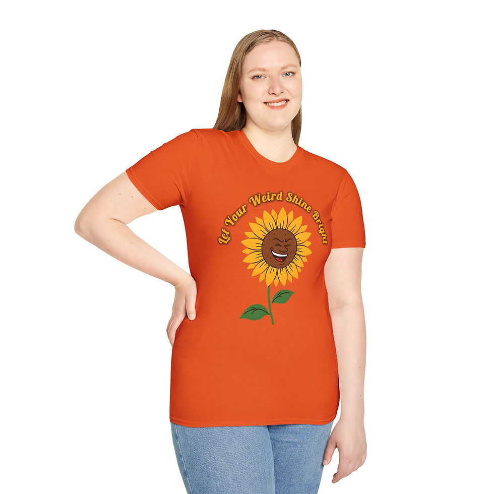 Thumbnail: Orange tee with yellow text Let your weird shine through arched over a smiling cartoon sunflower