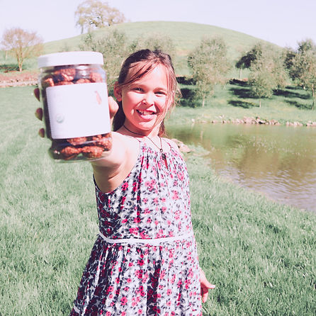 A picture of Charleigh showing off a jar of cookies