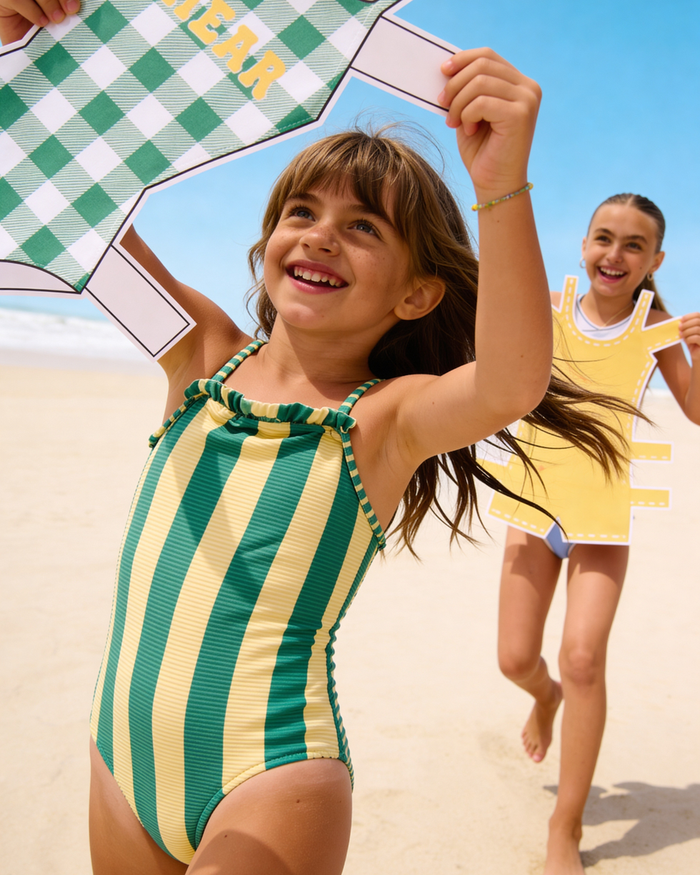 Two children playing on a sunny beach.