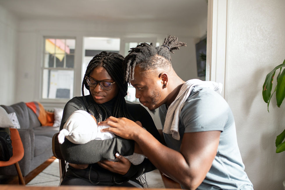 couple holding baby