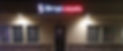 The elegant storefront of Harry's Carpets in Napa, California, at twilight, featuring a warm, glowing showroom interior and professional signage that highlights our boutique flooring experience.