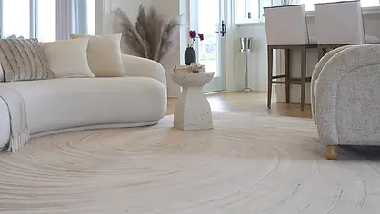 A high-end residential living room featuring a Nourison luxury designer rug with intricate patterns, professionally installed by Harry's Carpets to elevate home interior design in Napa.