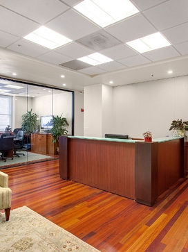 Modern office reception area featuring rich hardwood flooring installed for Litke Properties in the Bay Area.