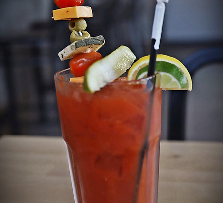 22 ounce house-smoked Bloody Mary with snack skewer, kosher pickle, lemon and lime