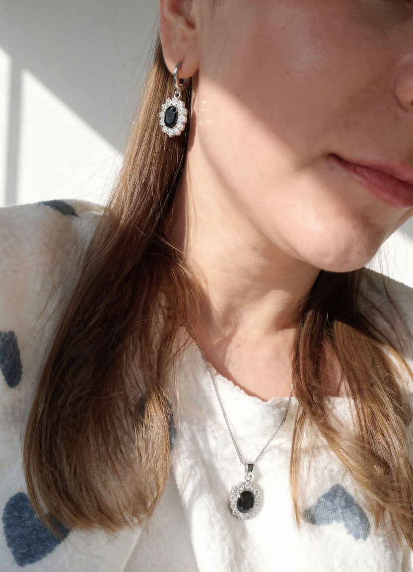 Thumbnail: Woman wearing a bridal necklace and earring set with crystal pendant