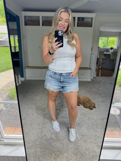 This textured mock Tank is double lined and a bit thick. I'm wearing a medium, but maybe should have got a large. It's perfect for layering.