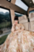Jessica Minh Anh in a golden couture dress by Japanese brand Yumi Katsura on the GoldenPass Express for Luxury in Motion campaign in Switzerland