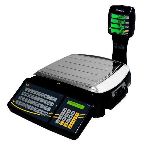 Balança digital preta e prata com teclado e tela LCD verde mostrando valores. Ambiente de loja ou mercado. Marca "Urano" visível.