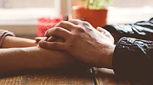 Two People Holding Hands Together Image