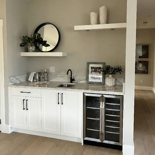 Residential main floor wet bar installation with sink and custom cabinets by Eztech in Calgary