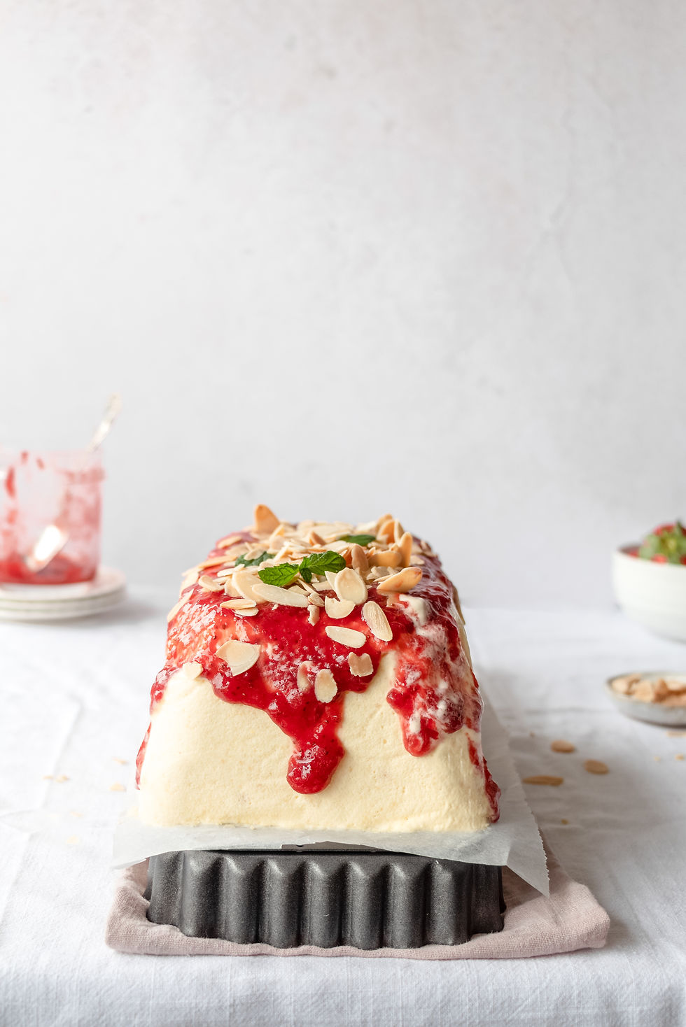 Semifreddo cake with almond praline and strawberry jam