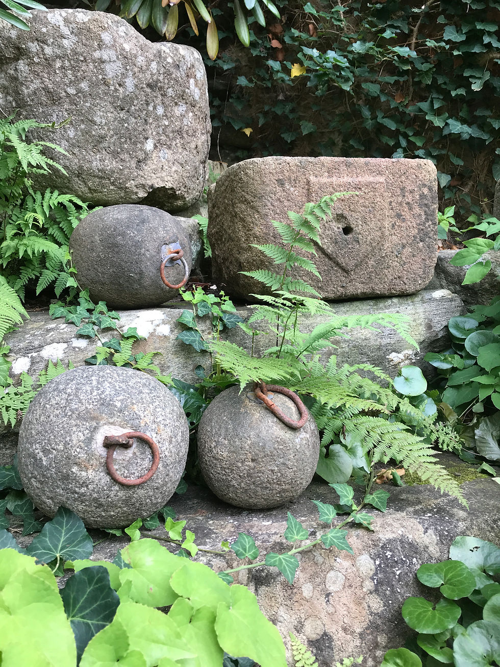 Thumbnail: Stone mooring bollards and granite basin.
