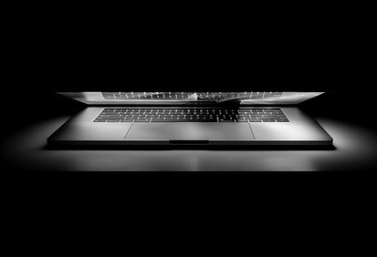 MacBook Pro on white surface_edited.jpg