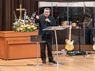 Rev Kenneth Huang preaching at CCMC. This is his story.
