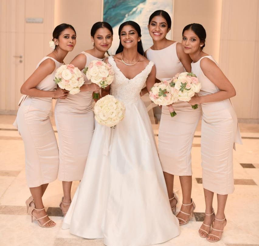 A bride and her bridesmaids posing for a picture at a wedding venue in Colombo, Shangri-la Colombo