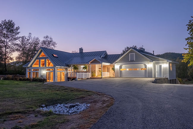 modern-cozy-lit-house-against-a-cloudy-sky-in-the-2025-02-09-20-18-38-utc.jpg
