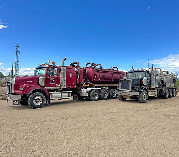 Red and Blue Septic Trucks