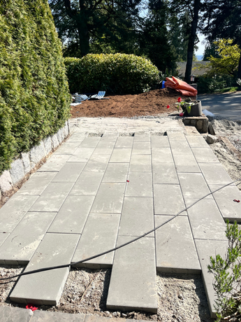 Stonework being placed on a patio