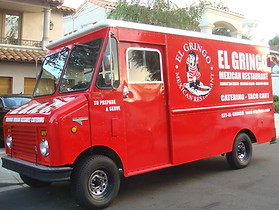 The GUAC Taco Truck parked in front of a customers home