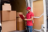 high-angle-delivery-man-checking-packages-list.jpg