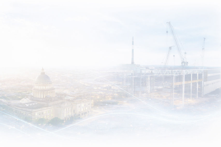 City government building and construction site with cranes, representing public infrastruc