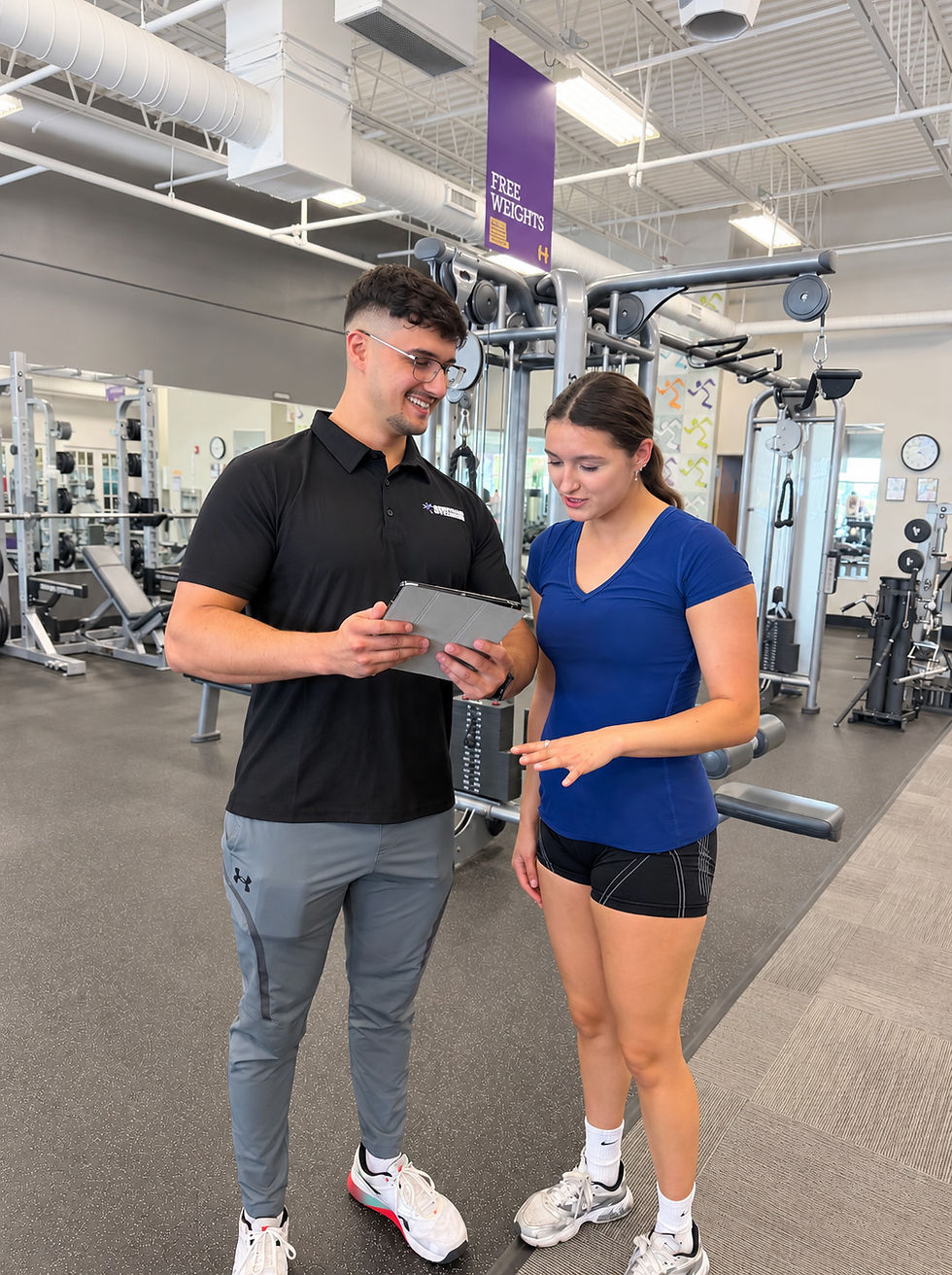 Personal trainer discussing a custom training plan with a client at Starck Fitness in Naperville.