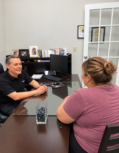 Weight loss medication and personal training consultation in Naperville with a Starck Fitness trainer meeting one-on-one with a client.