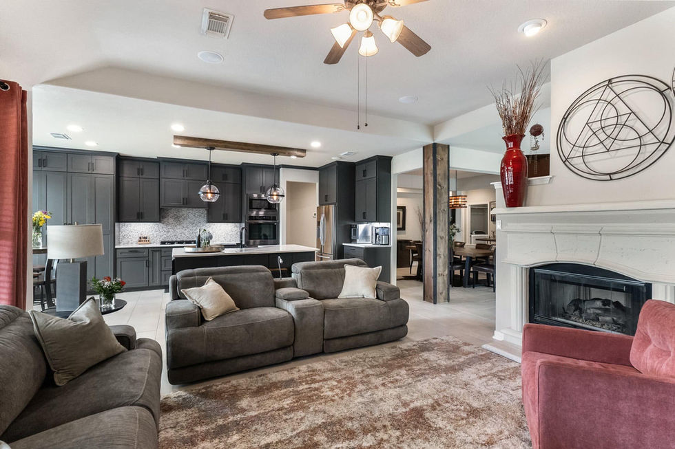 a living room with a couch and chairs and a ceiling fan in texas