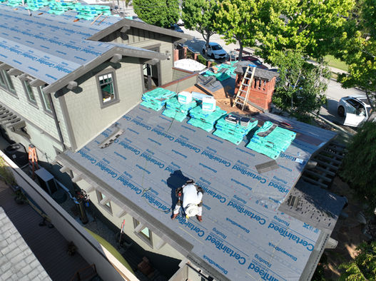 Residential roofing repair in progress using CertainTeed materials.