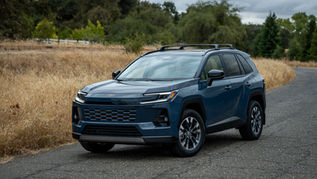 Storm Cloud 2026 Toyota RAV4 Limited AWD exterior front three quarter on country road