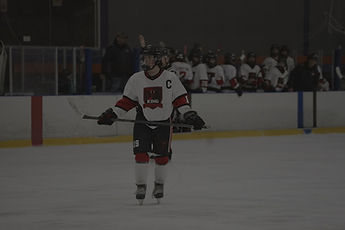 King Cobras player on ice with stick in both hands