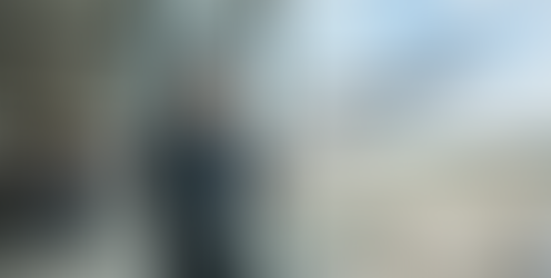 A man talks on his smartphone at an airport