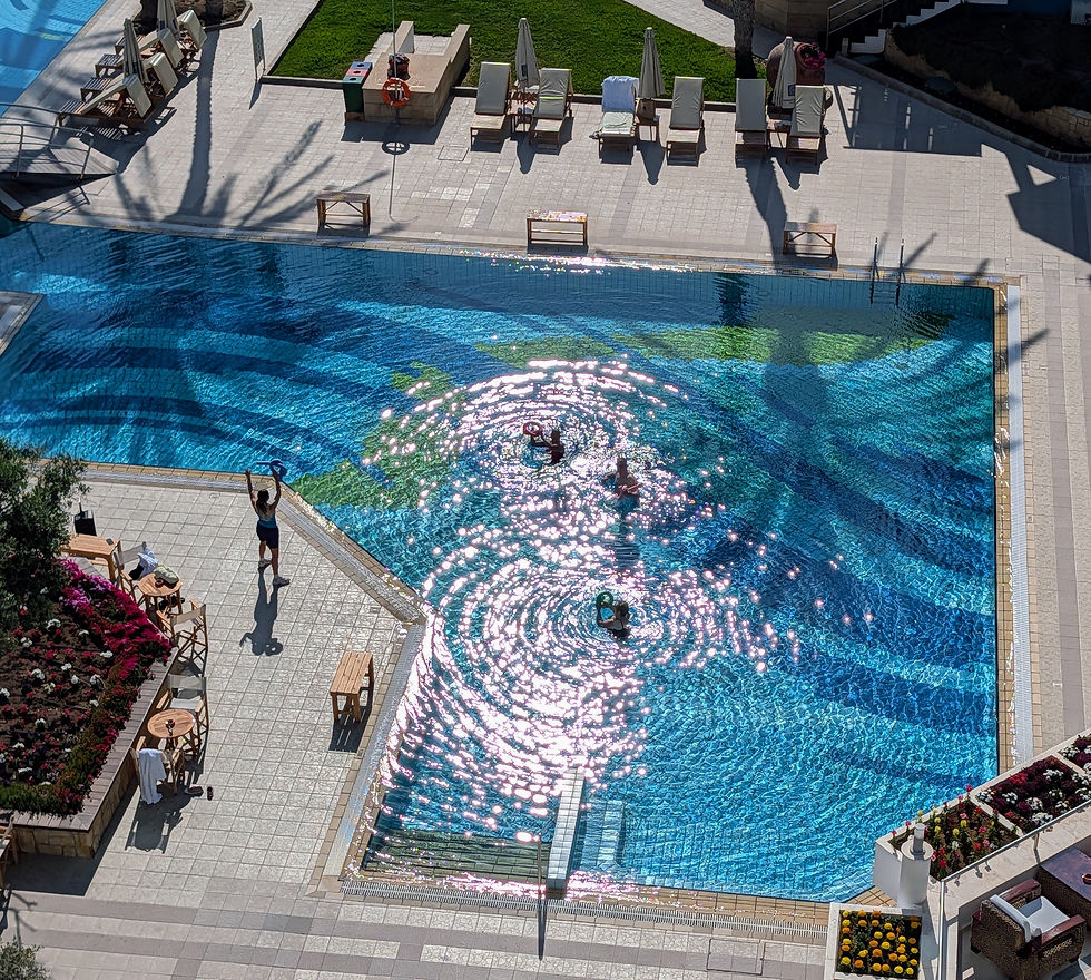 Cooling down with a pool yoga session at the Asimina Suites Hotel