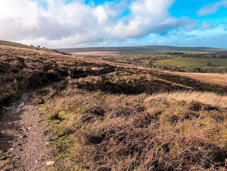 A lone hker makes their way up the northern flanks of Dunkery Beacon