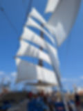 Sea Cloud Spirit sailing under full sail off the coast of Sicily
