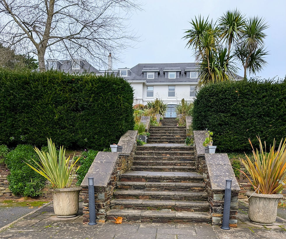 St Enedoc Hotel, above its steps in rock
