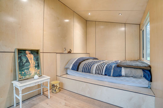 Interior view of the bedroom inside the bunkie, displaying its comfortable and inviting sleeping area
