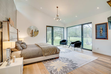 Interior view of the master bedroom in the modern Ranch home, showcasing its spacious and comfortable design