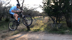 Triathlete cycling on a mountain bike