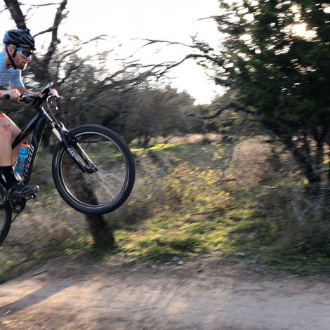 Triathlete cycling on a mountain bike