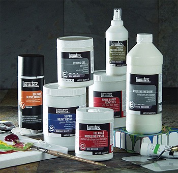 Liquitex adhesives sitting on table