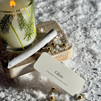 Glow with a candle and surrounded with snow