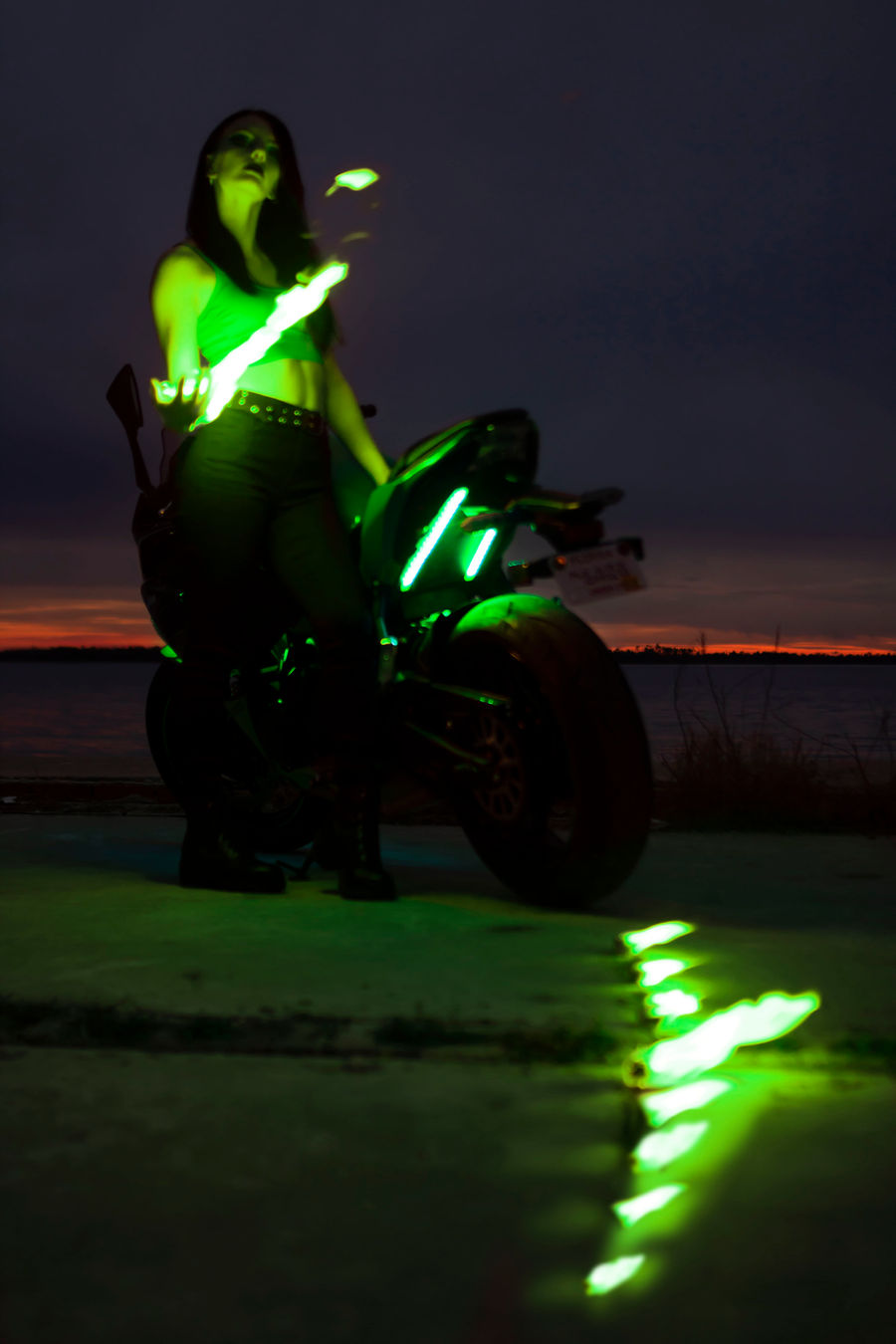 Model with green flame effect at dusk