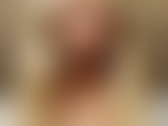 The Empress tarot card from the One Celtic Witch Enchanted Tarot deck featuring a crowned blonde woman with piercing blue eyes, wearing a gold royal crown and white gown, symbolizing feminine strength, abundance, and nurturing power.