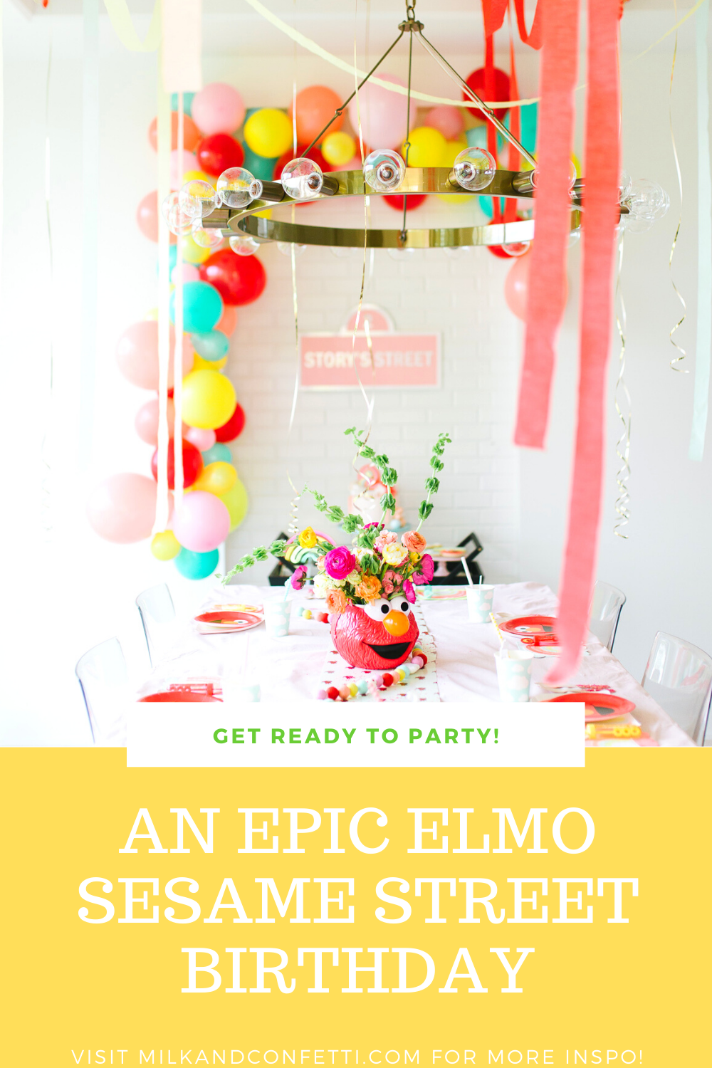 A Sesame Street Elmo Second birthday party with balloons, streamers cake and flowers!