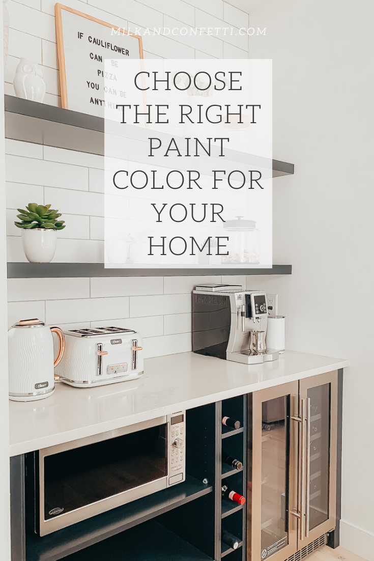 A kitchen done with dusty blue black cabinets