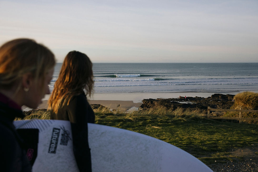 surfer girls looking for waves in Cornwall